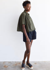 flowy olive green top with scalloped hem